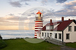 Sunset by Candy Cane Lighthouse in New England